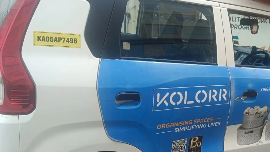 LetzRyd WagonR wrapped in a KOLORR home storage ad