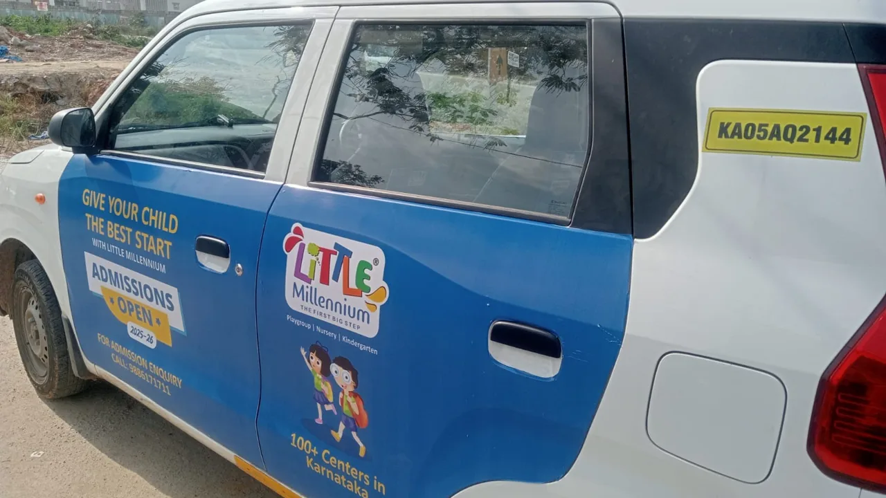 LetzRyd WagonR wrapped in a Little Millennium preschool admissions ad
