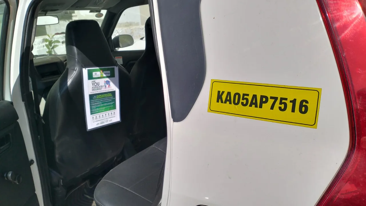 Seat-back ad card facing the rear passenger of a LetzRyd WagonR