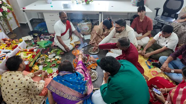 Team gathered around the offerings during an office pooja